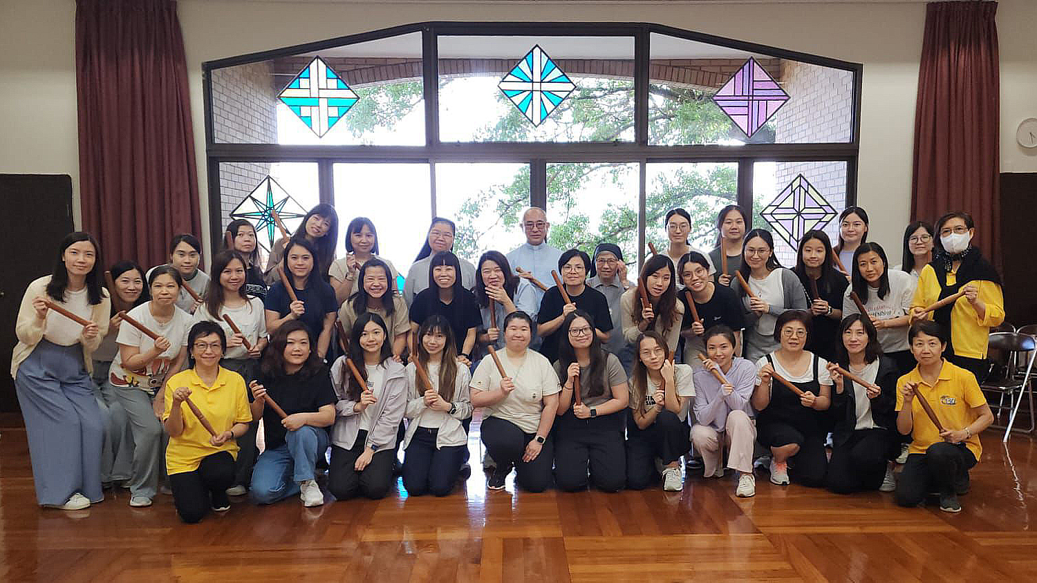 Rev. Dominic Chan leads teachers of Sacred Heart Canossian Kindergarten on their retreat to experience the spirit of Tai Chi Spirituality