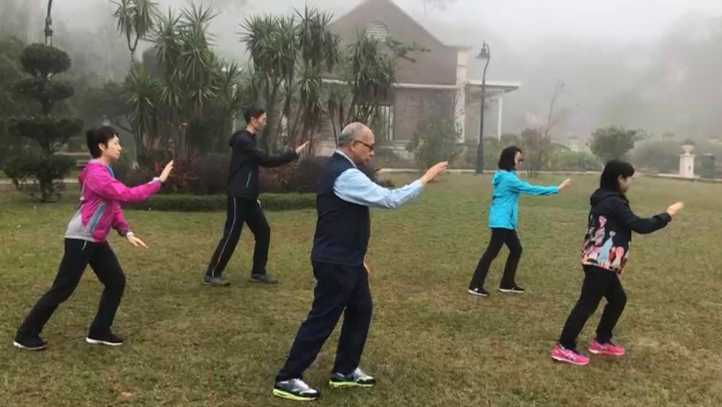 Rev. Dominic Chan and assistants practise Tai Chi Spirituality at the Peak