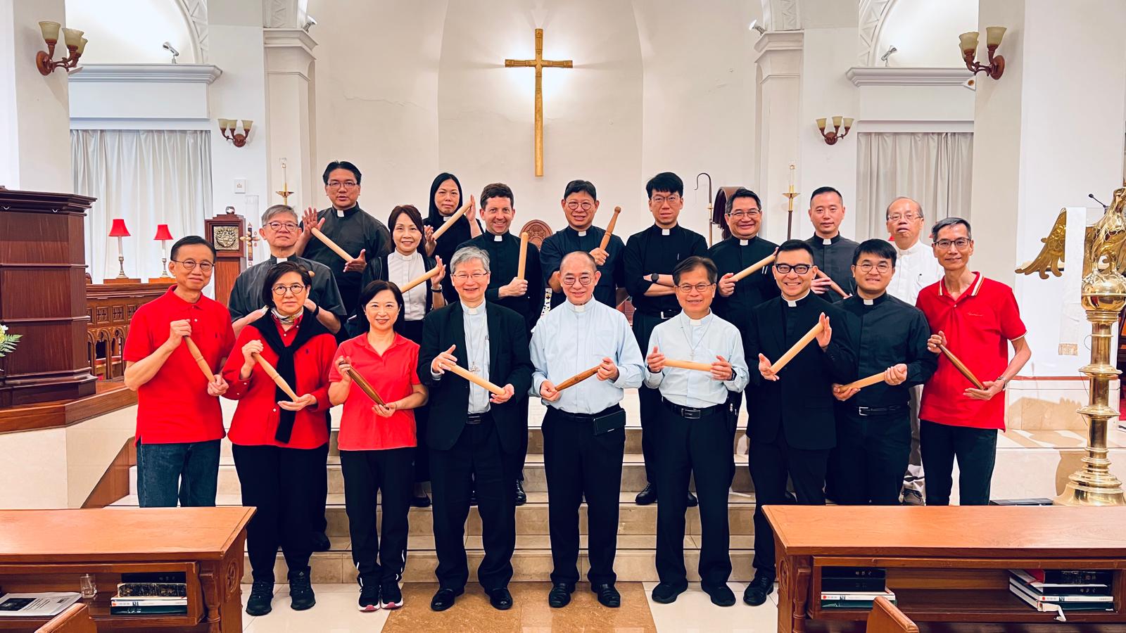 Clergymen of the Diocese Western Kowloon Sheng Kung Hui practicing Tai Chi Spirituality with the Tai Chi ruler